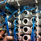 A man performs maintenance work in the reverse osmosis building at the Carlsbad Desalination plant Thursday, May 26, 2022, in Carlsbad, California. The facility is the Western hemisphere’s largest desalination plant, which removes salt and impurities from ocean water.